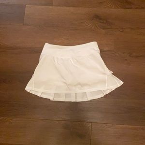 White skirt with ruffles on the back